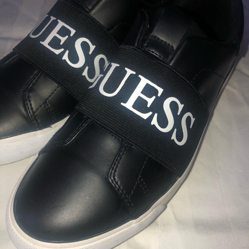 Black GUESS slip-ons